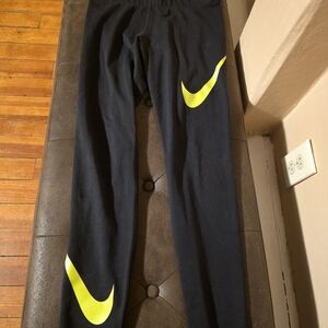 Nike Kids Black Leggings with Neon Yellow Swoosh Accents